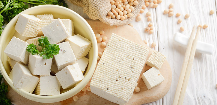 Celebrating tofu blog thumbnail image, a photograph of firm tofu cut up and placed into a bowl