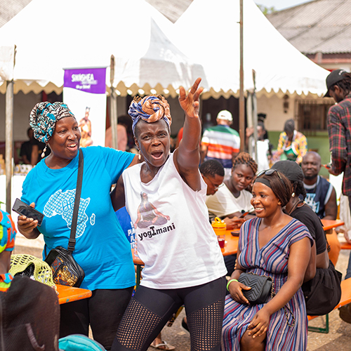 People cheering at Plantbased Vegan Market Ghana