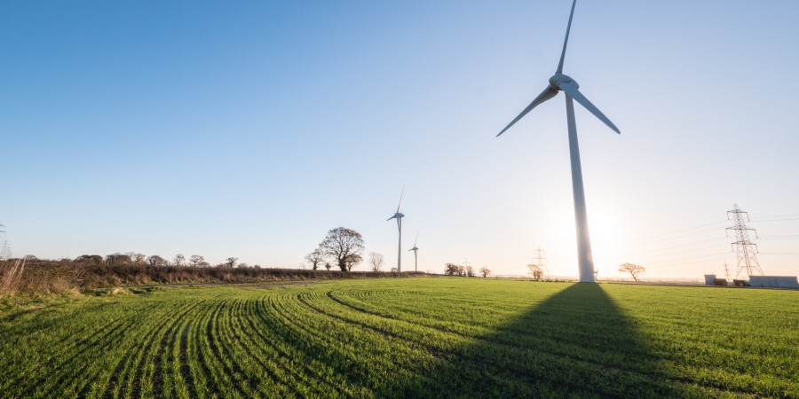 Windmill in a field on a sunny day